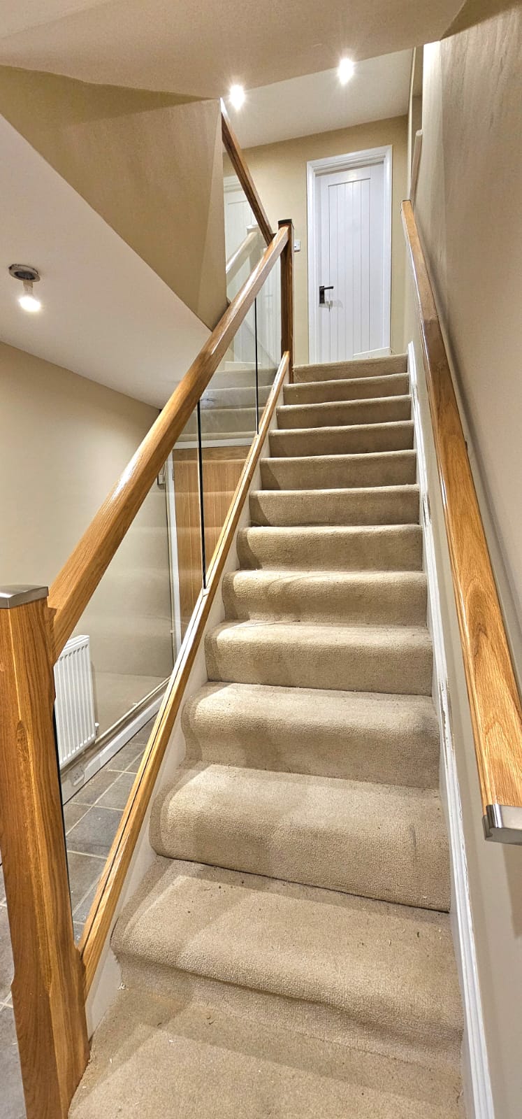 Carpeted stairs with Oak staircase