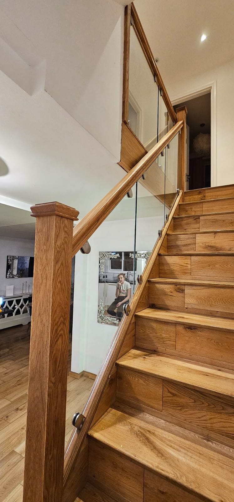clamped glass balustrade on an oak staircase