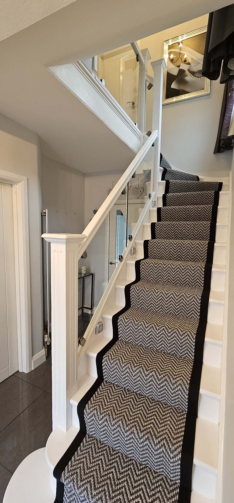 white staircase with glass balustrade