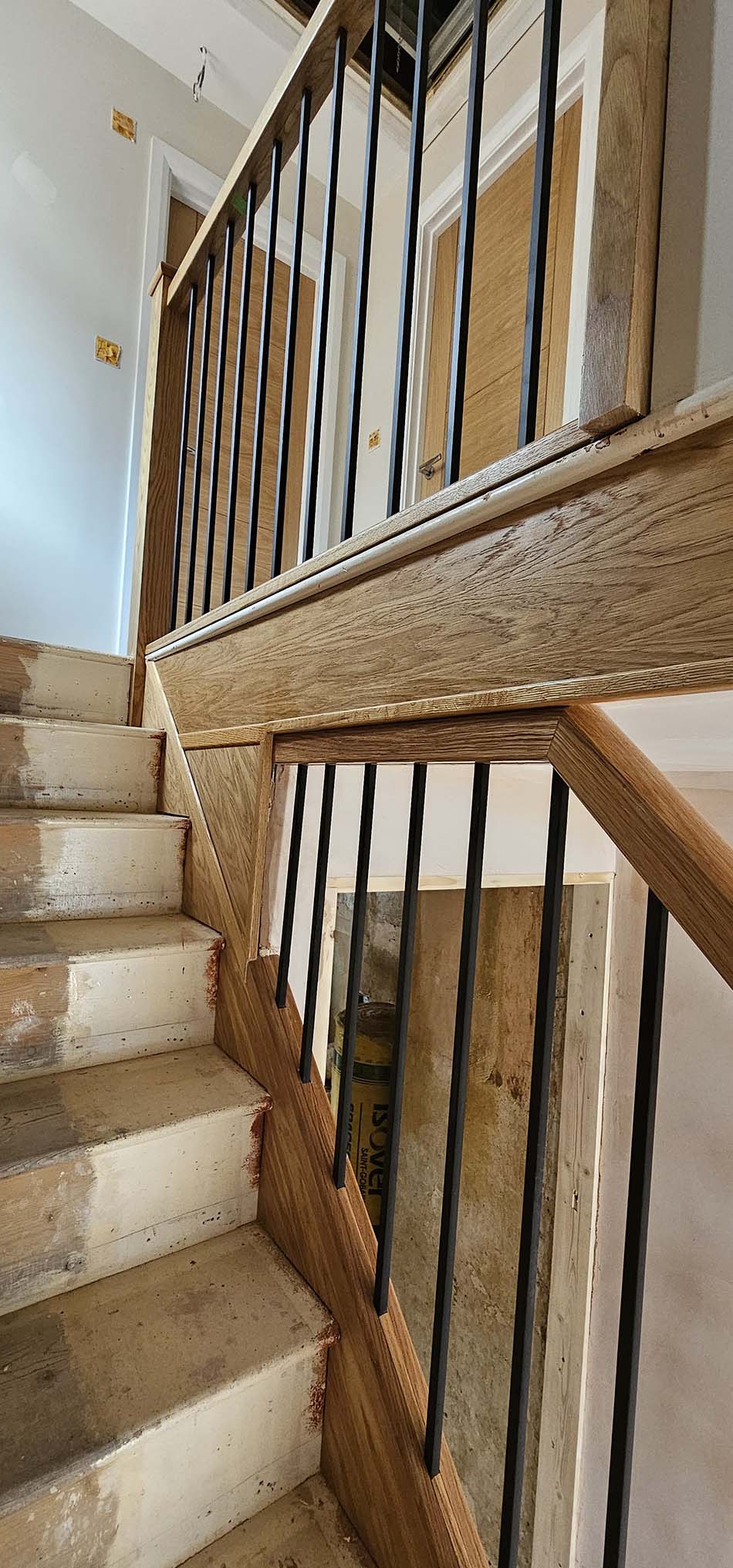 Black metal spindles of a staircase