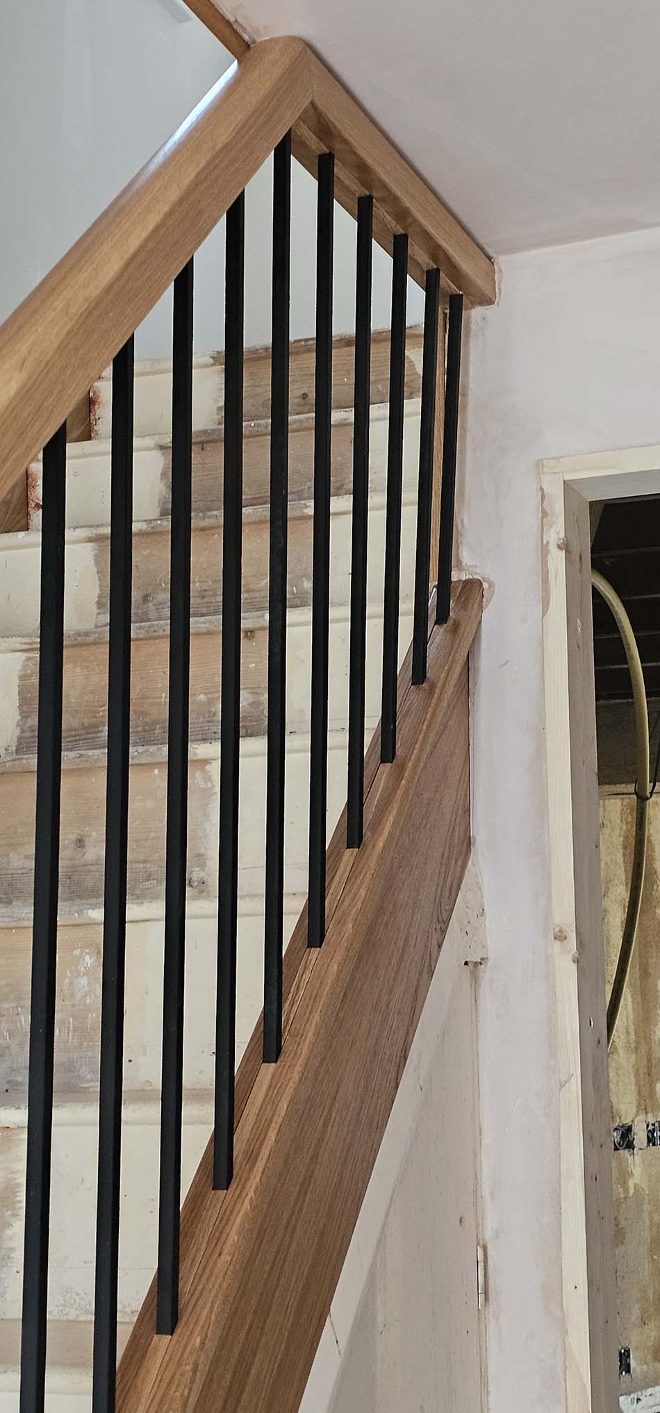 wood and black metal staircase