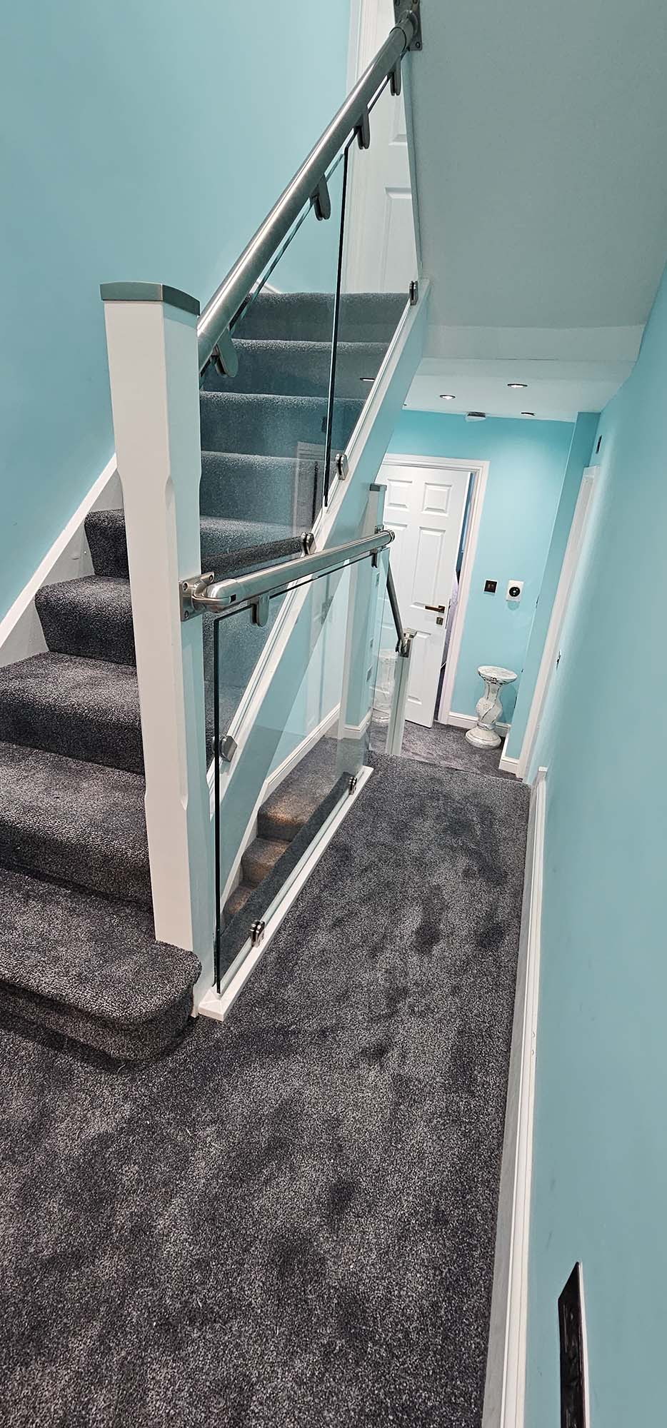 stainless steel staircase with glass balustrade