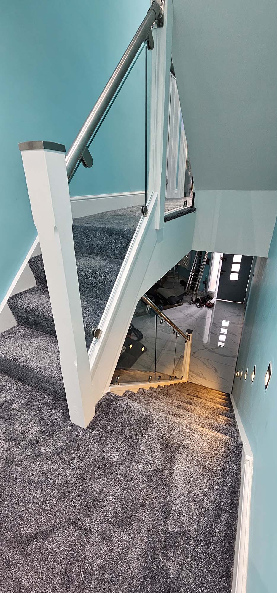 white and stainless steel staircase