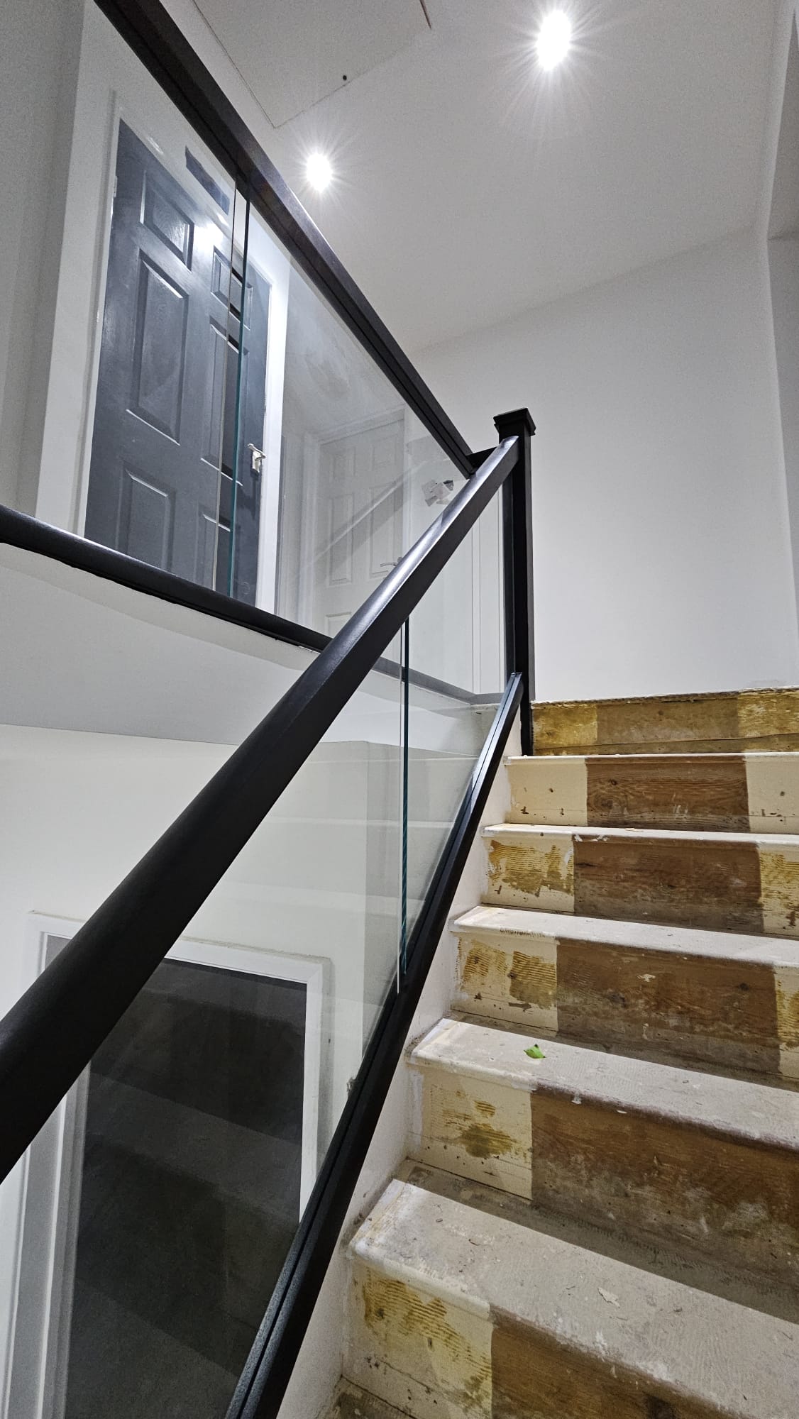 black bannister and embedded glass balustrades
