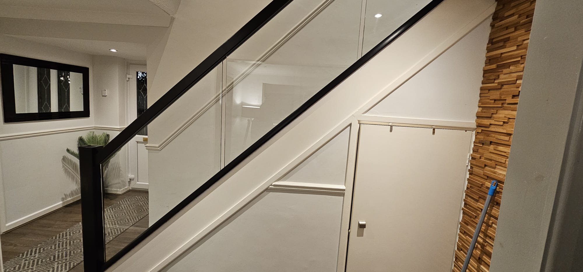 black staircase with glass balustrade