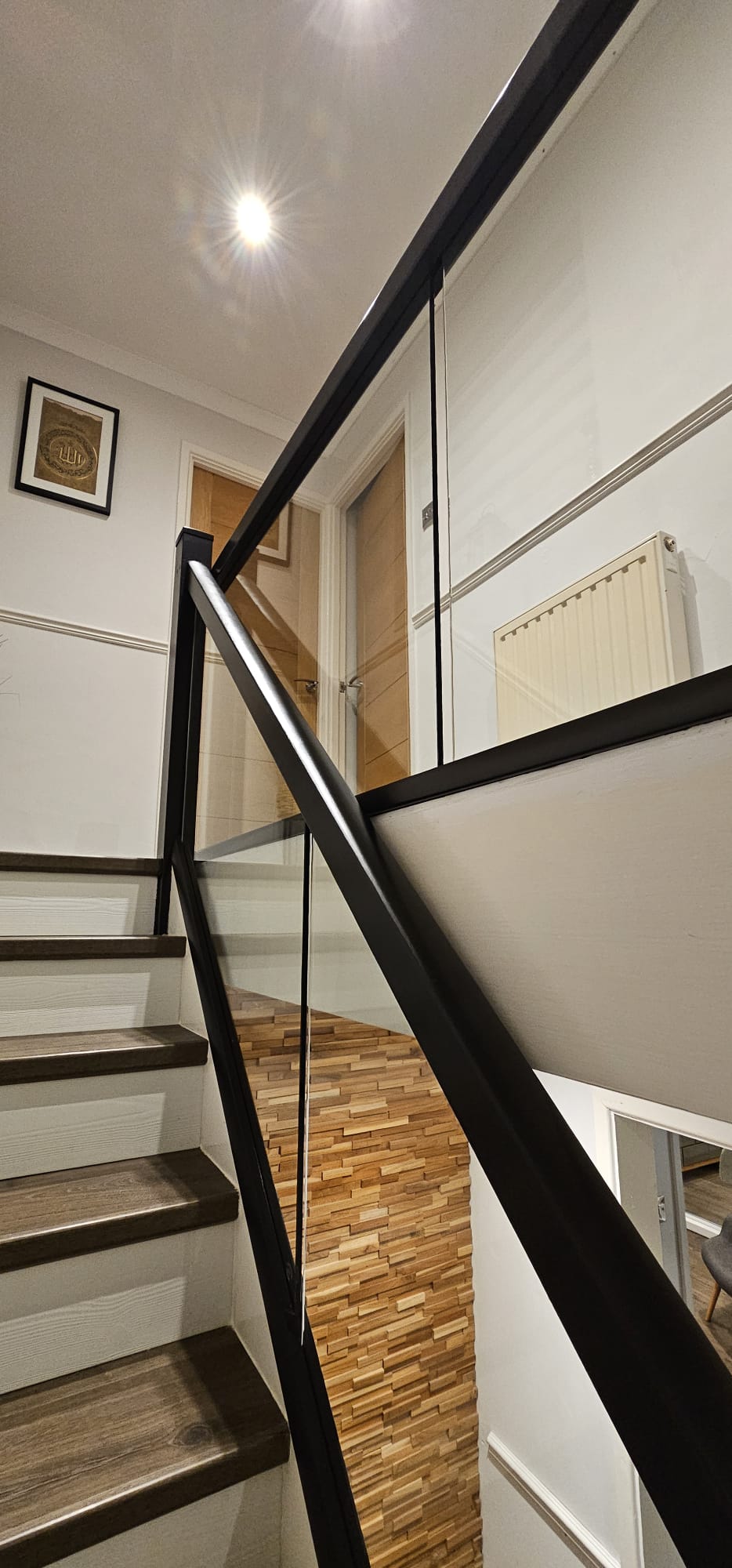 glass balustrade and black bannister