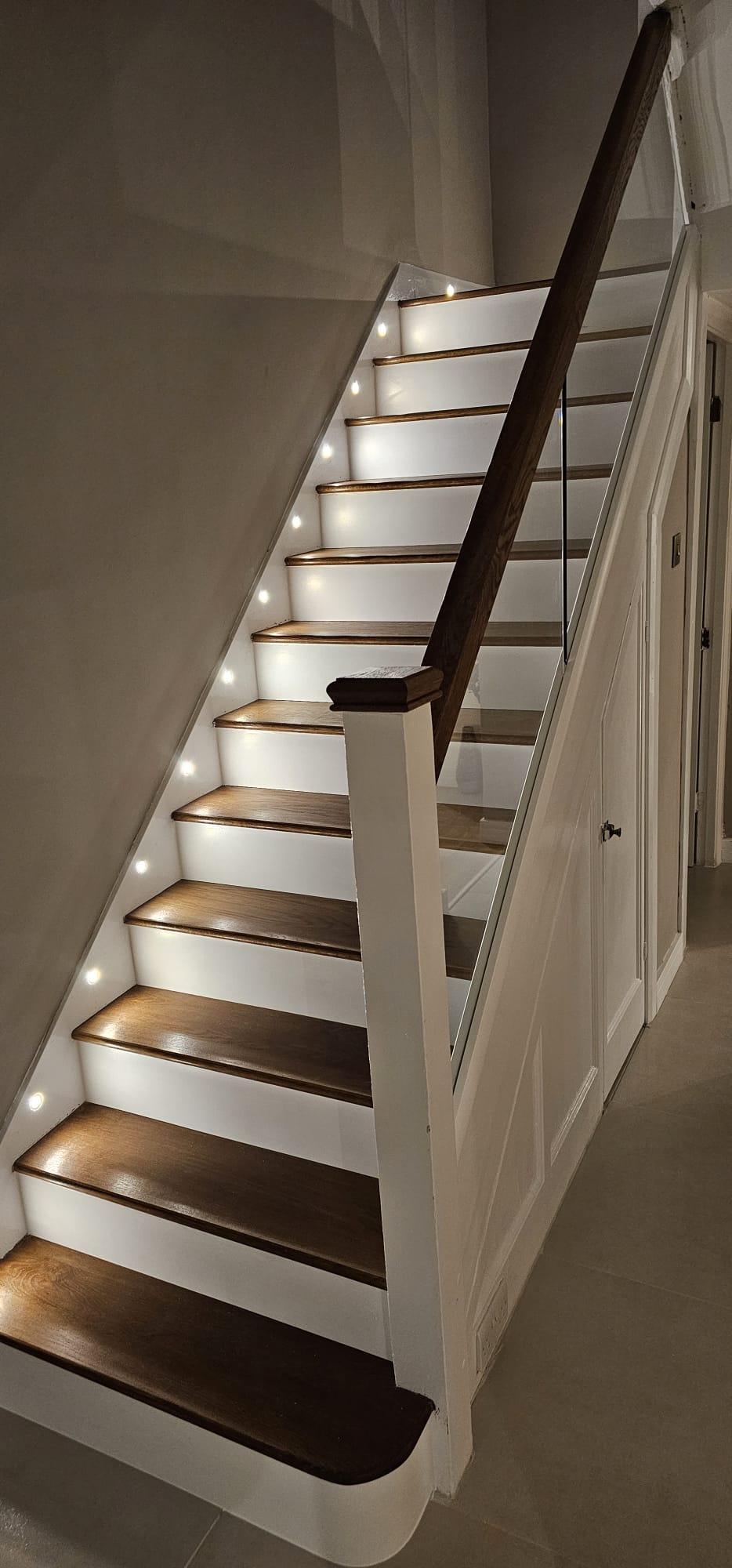 Oak and white staircase with stair lights